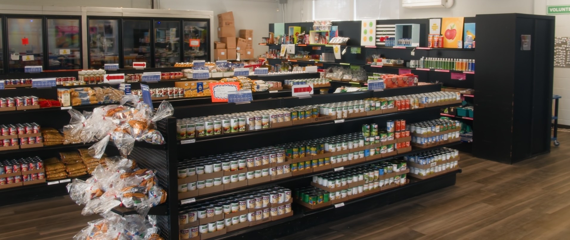 Shelves stocked with groceries at the CARES Family Pantry