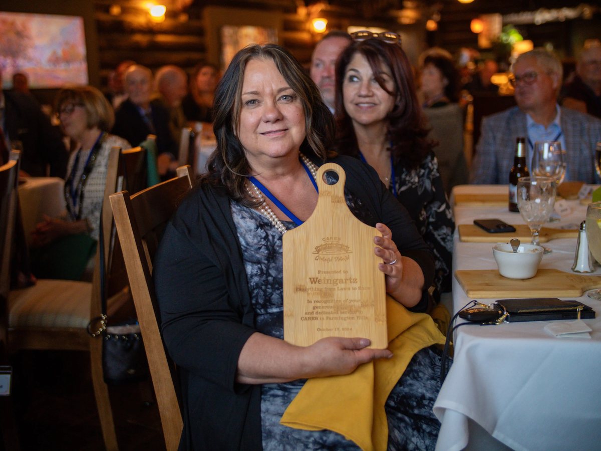A sponsor receives her cutting board